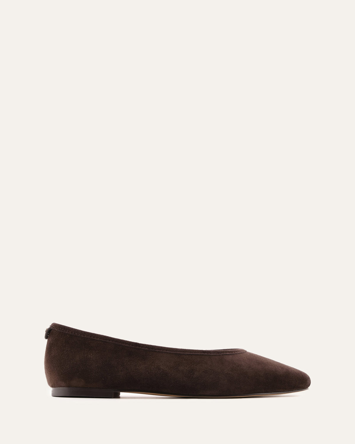 Brown suede flat shoe on a white background