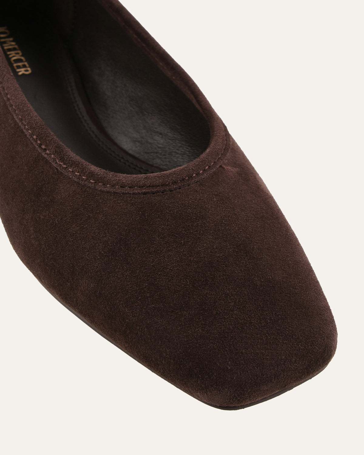 Brown flat shoe on a white background