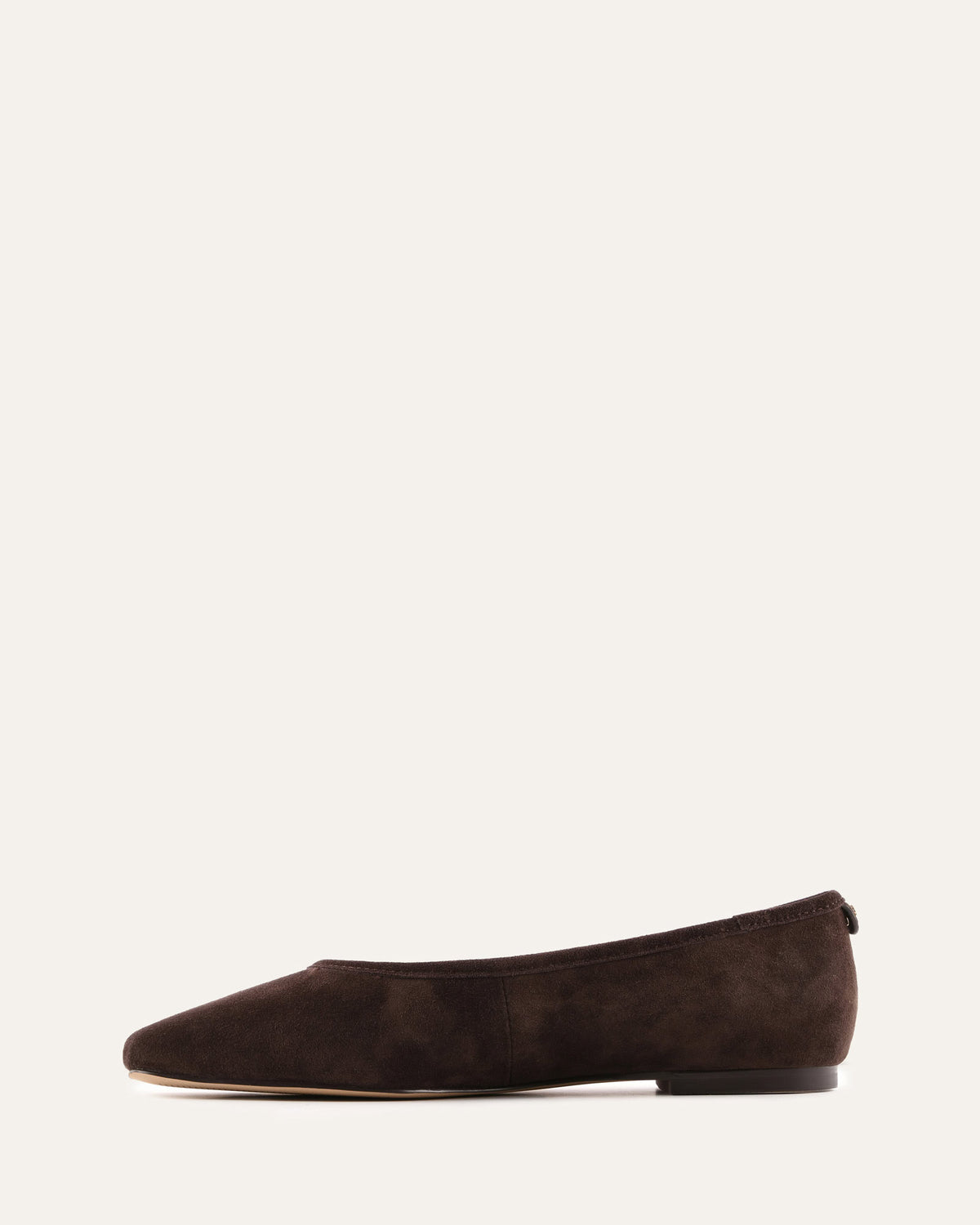 Brown suede flat shoe on a white background