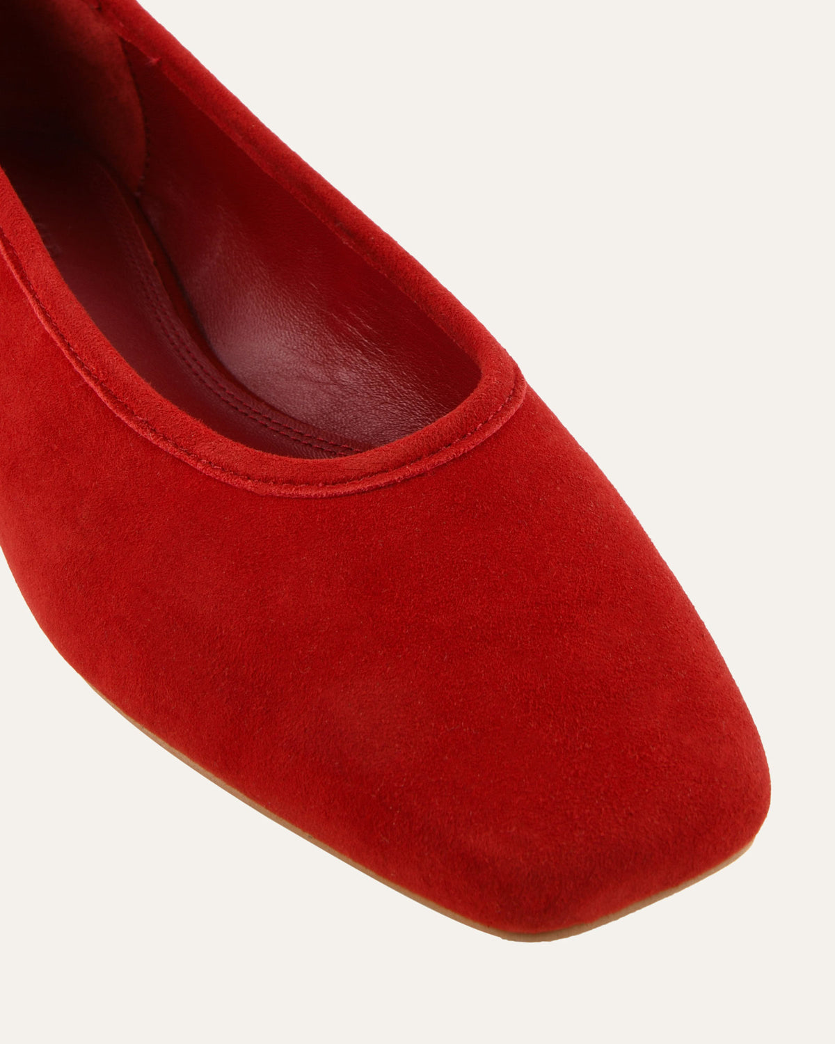 Red suede shoe on a white background