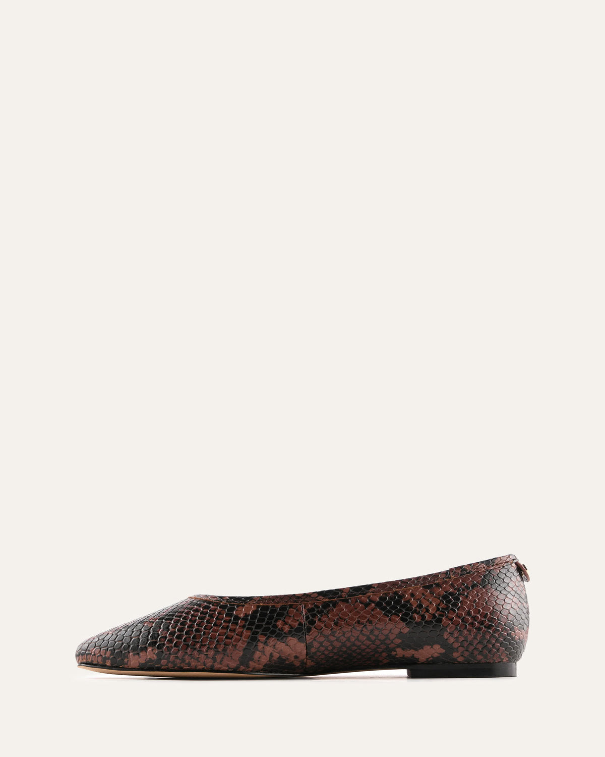 Brown snake print flat shoe on a white background