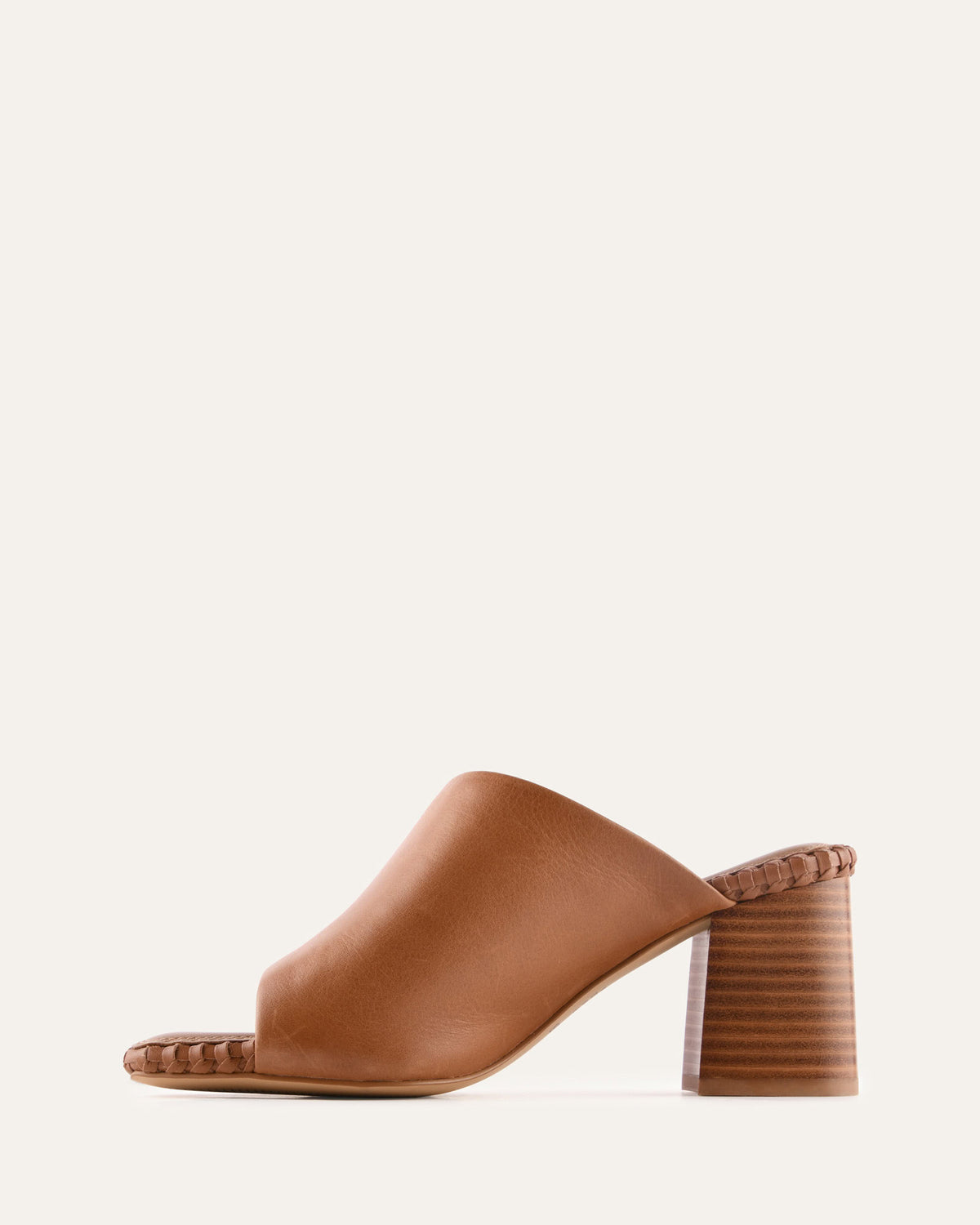 Brown open-toe sandal with a block heel on a white background