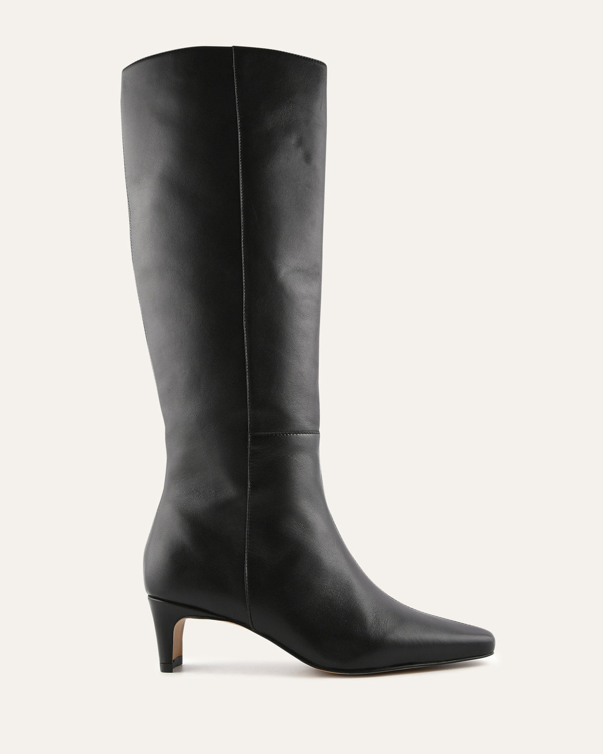Black knee-high boot on a light gray background