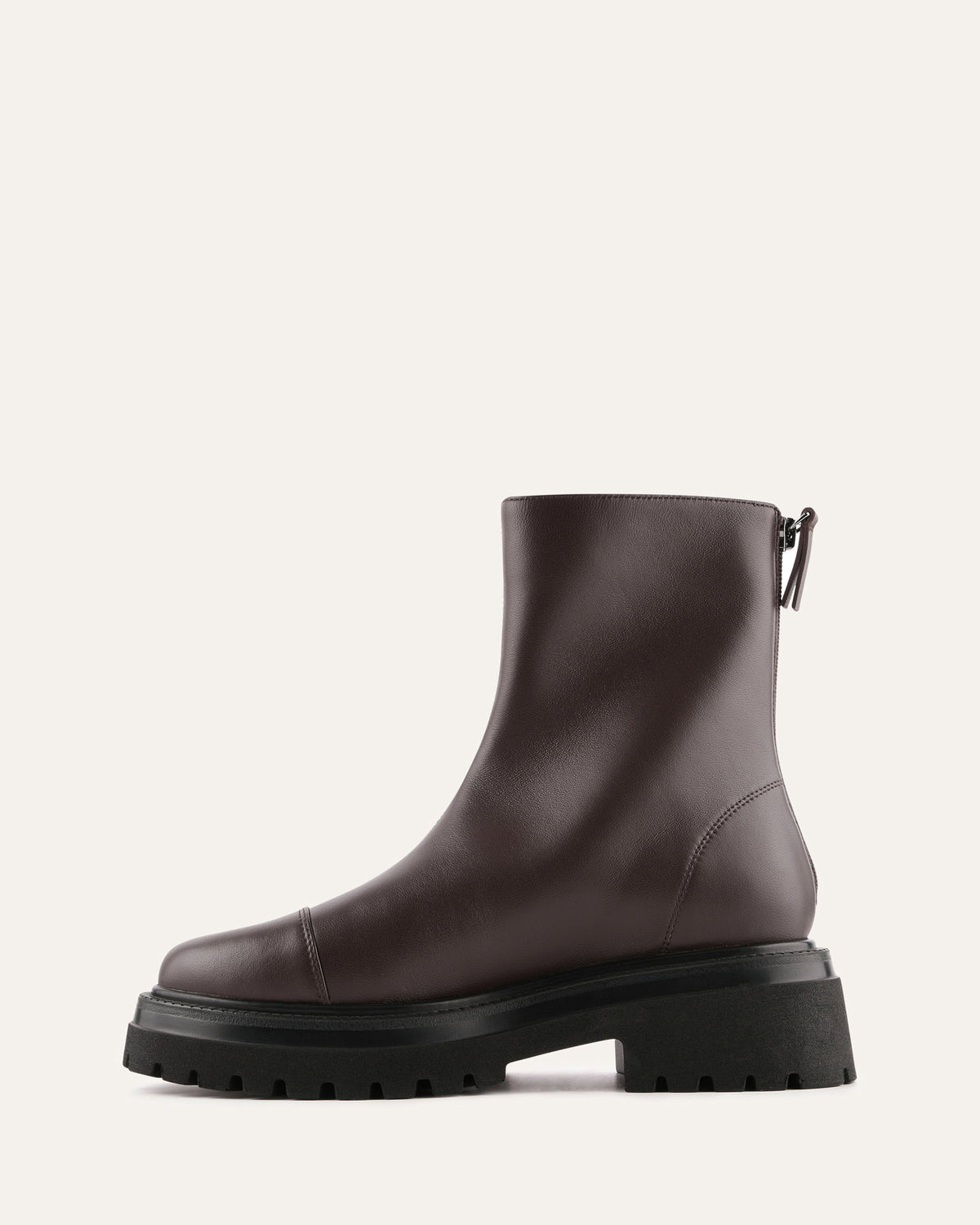 Brown leather boot with a black sole on a white background