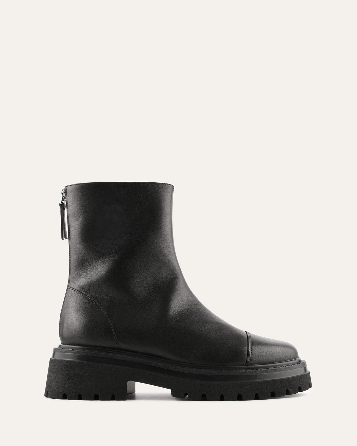 Black ankle boot on a light gray background