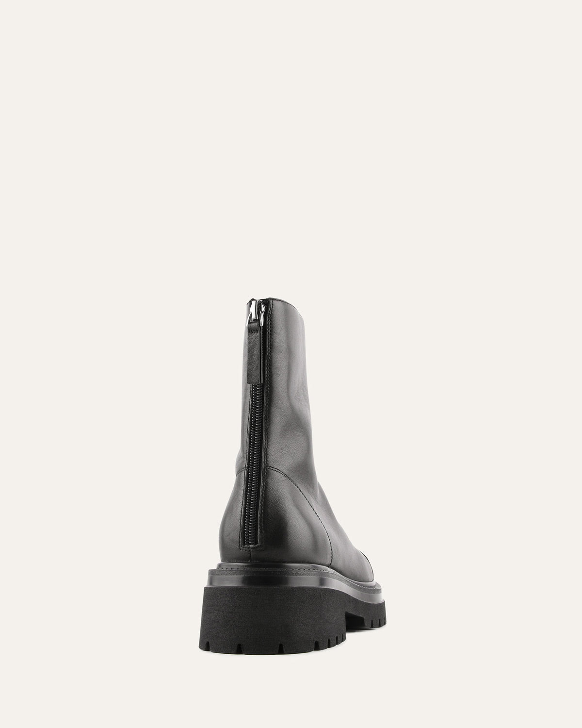 Black leather boot on a white background