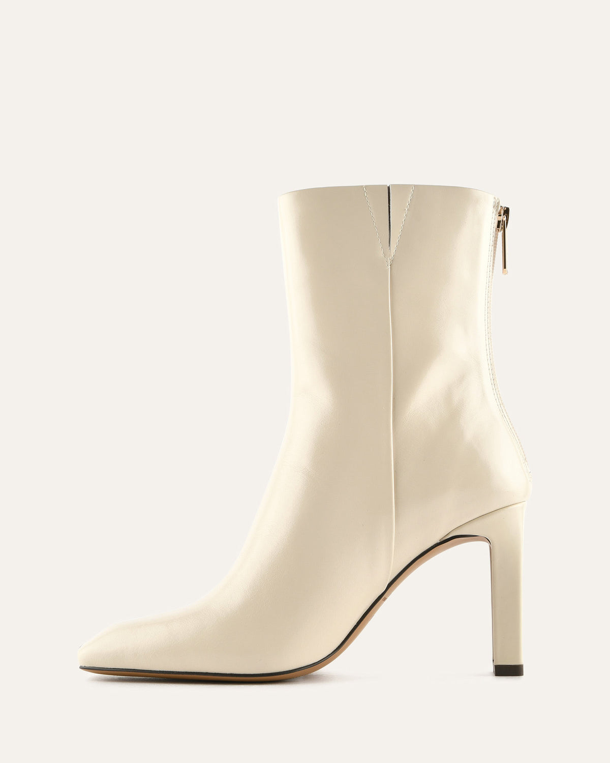 White ankle boot on a light gray background