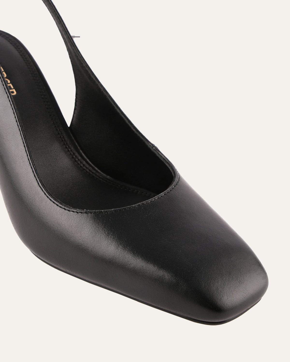 Black high-heeled shoe on a white background