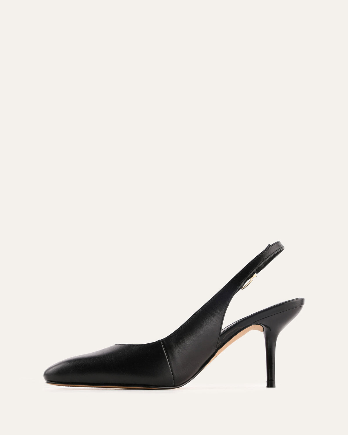 Black high-heeled slingback shoe on a white background