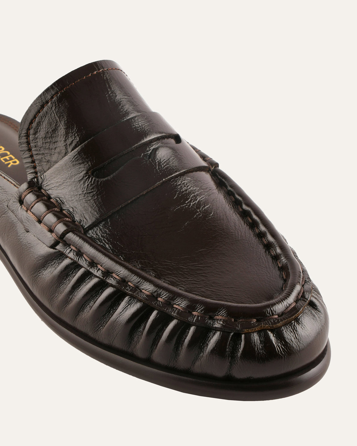 Brown leather loafer shoe on a white background