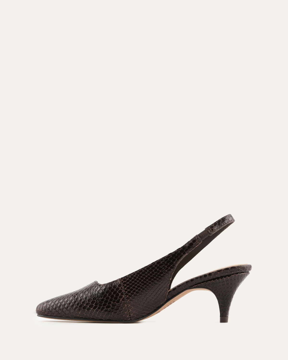 Black slingback shoe on a white background