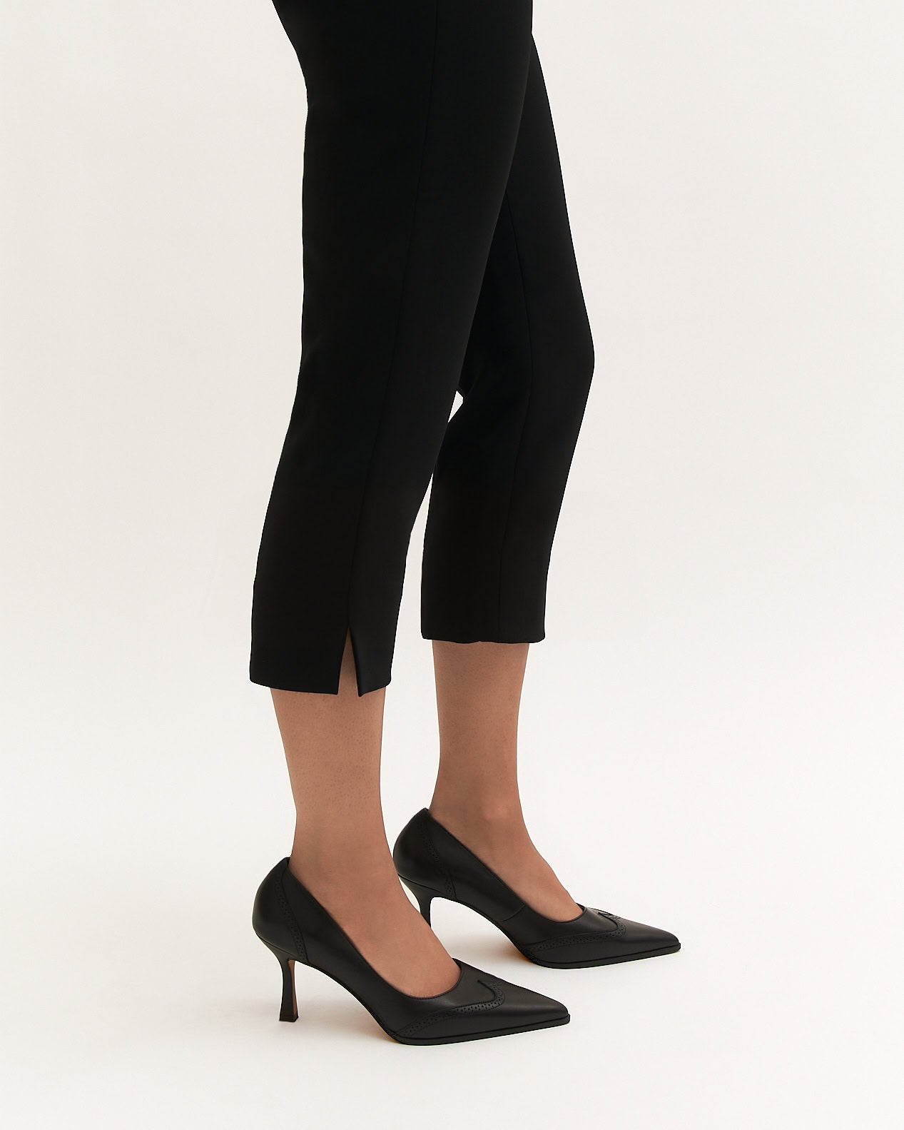 Black high-heeled shoe on a white background