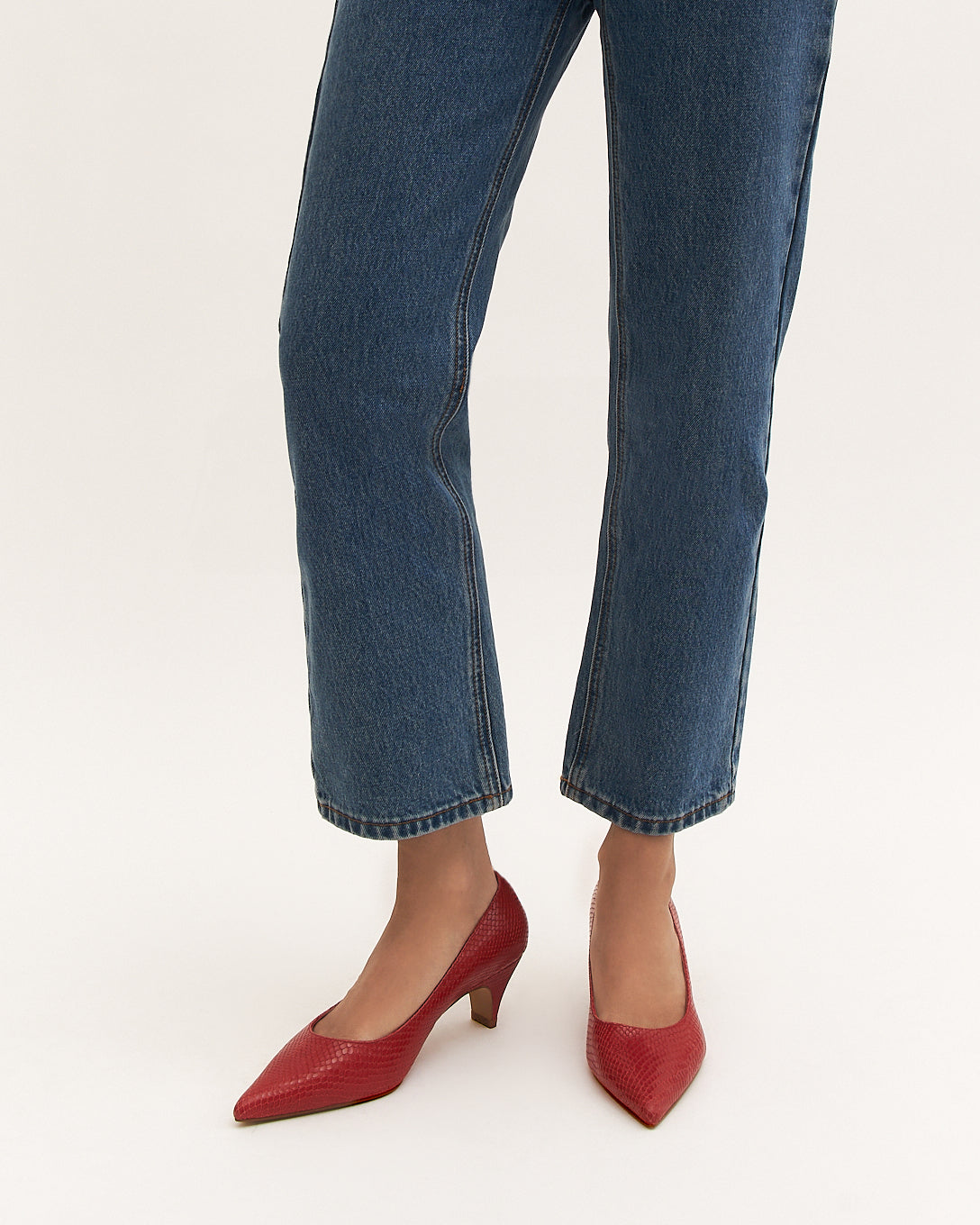 Red high-heeled shoe on a white background