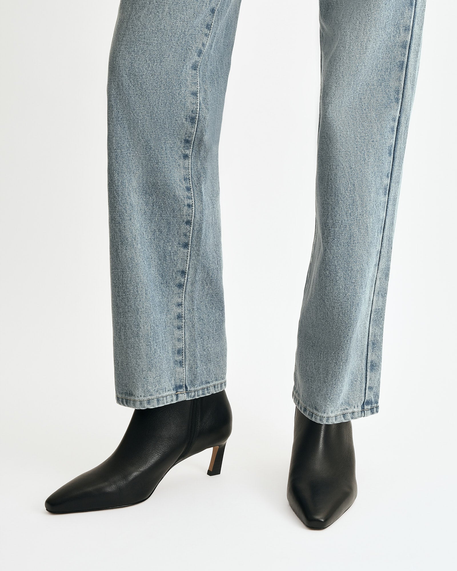 Black ankle boot on a white background