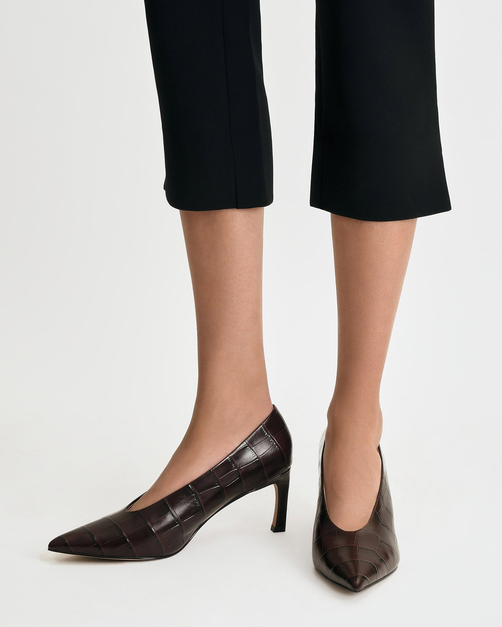 Brown high-heeled shoe on a white background