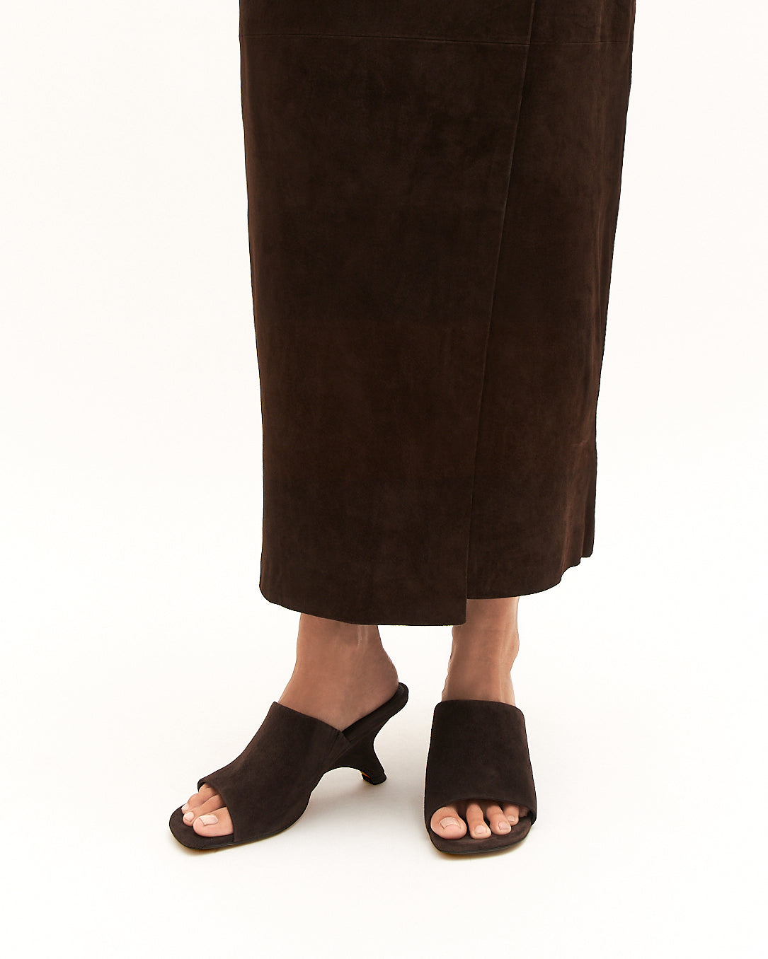 Brown open-toe shoe on a white background