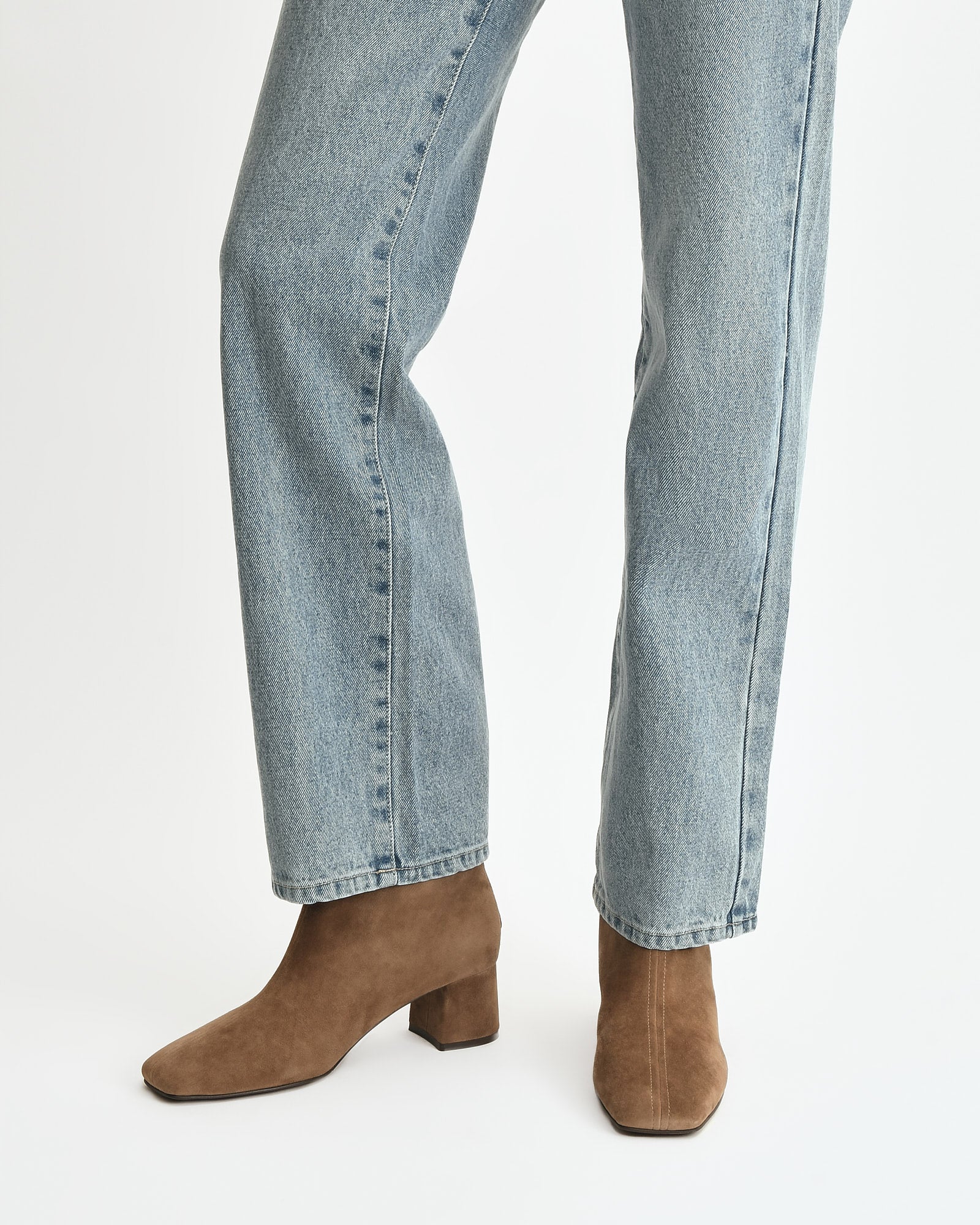 Brown suede ankle boot on a white background