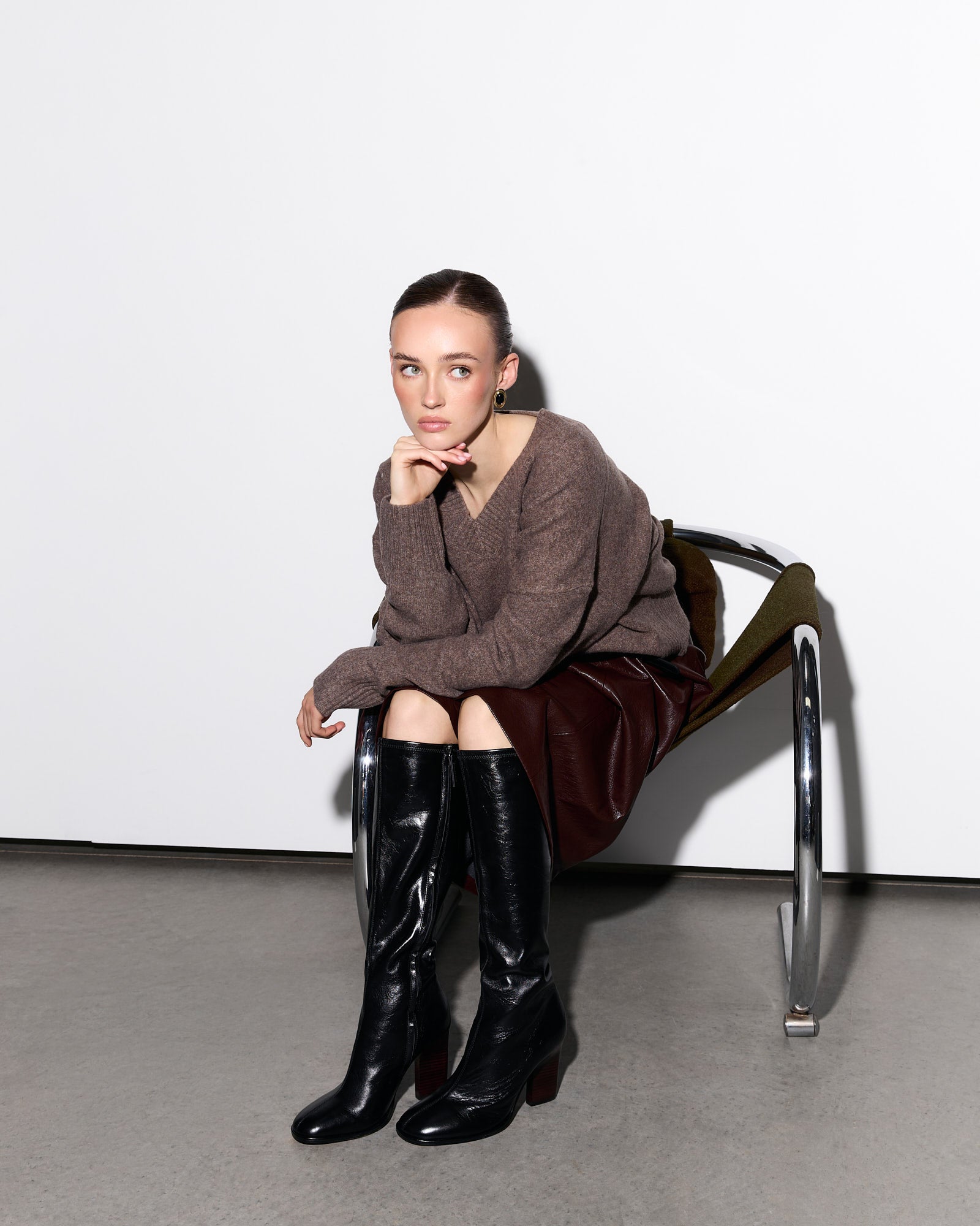 Black knee-high boot on a white background