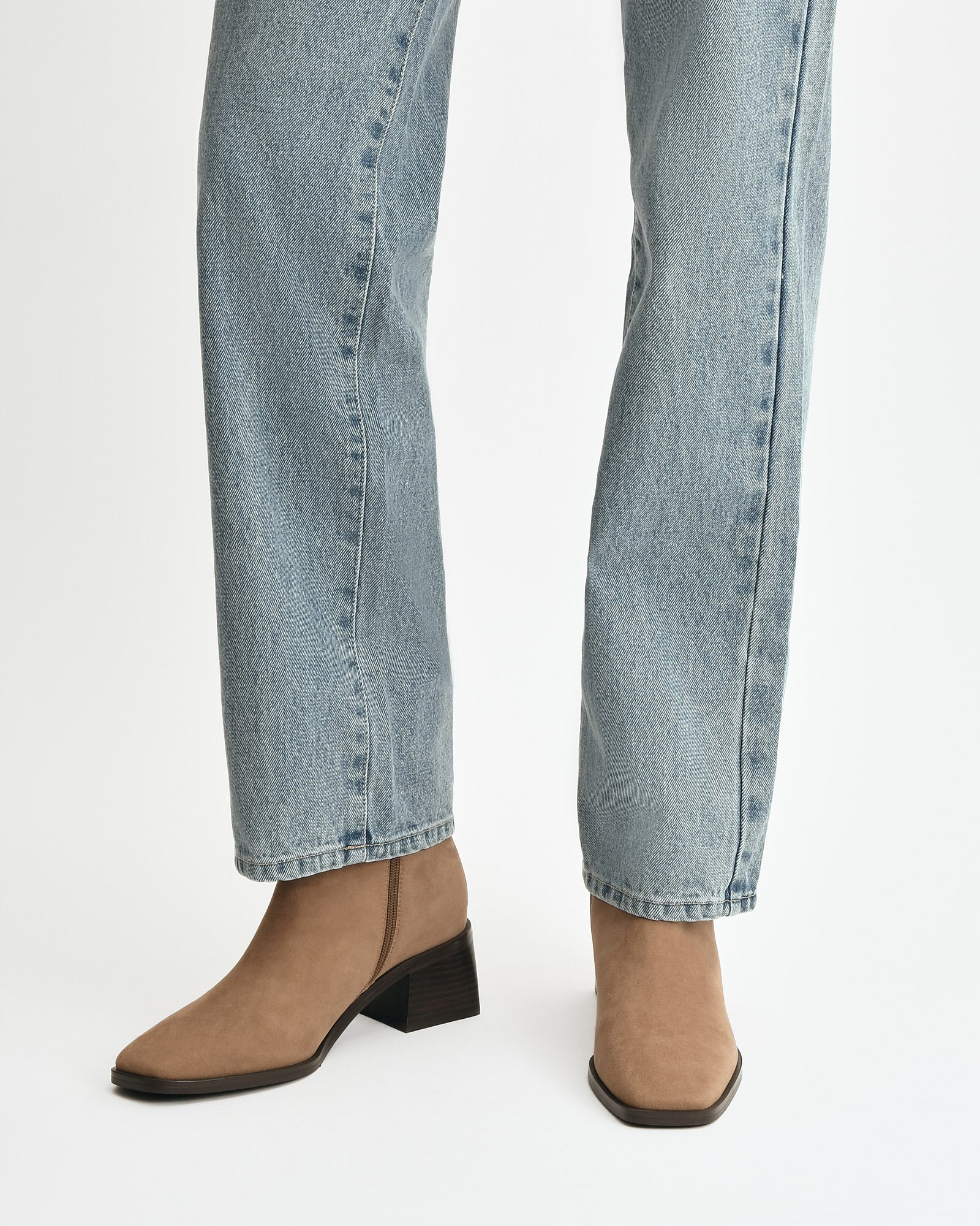 Tan ankle boot on a white background