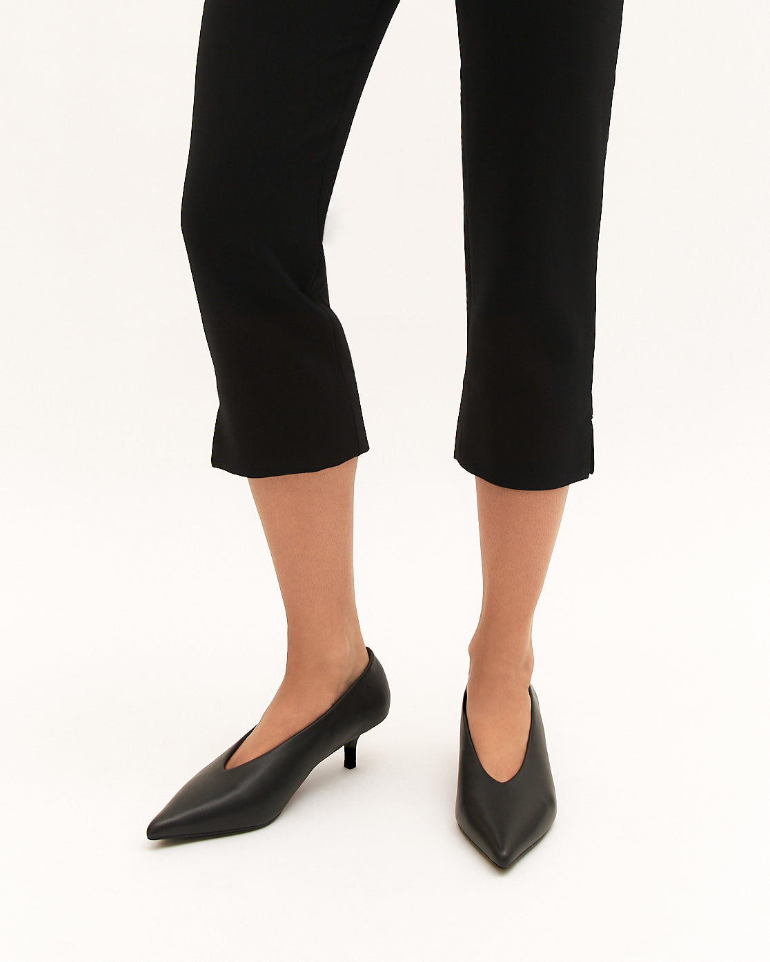 Black high heel shoe on a white background