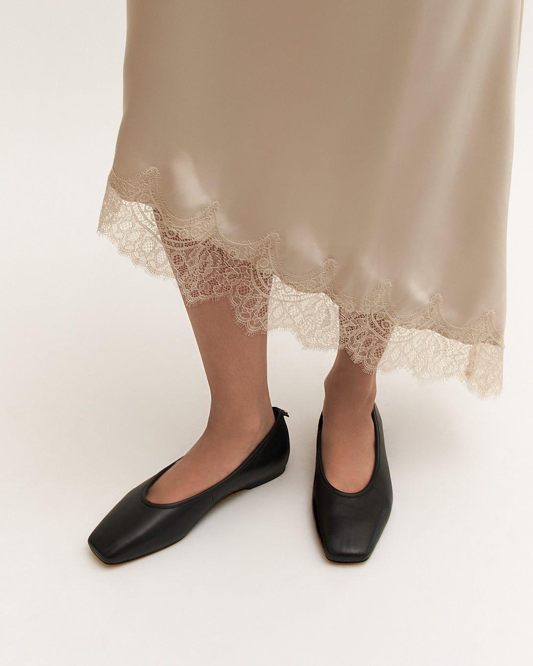Black flat shoe on a white background