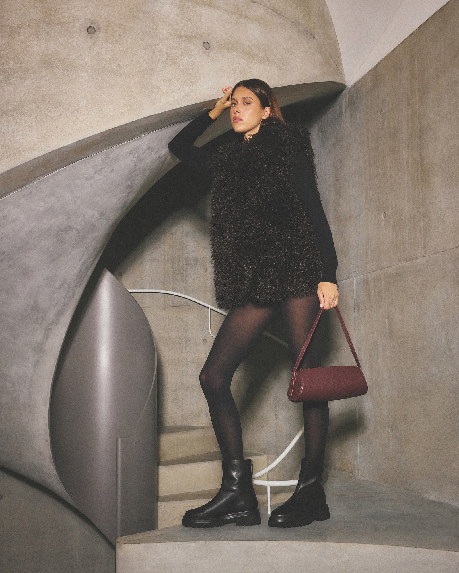 Black ankle boot on a light gray background