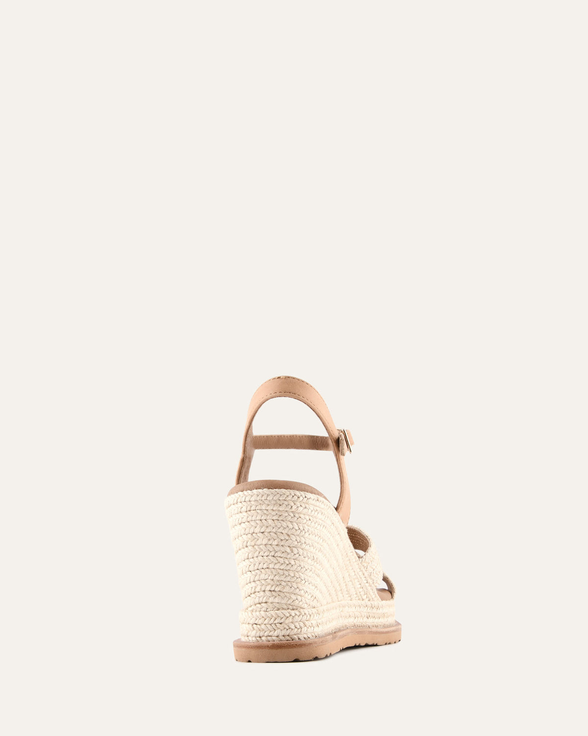 Woven wedge sandal on a light gray background