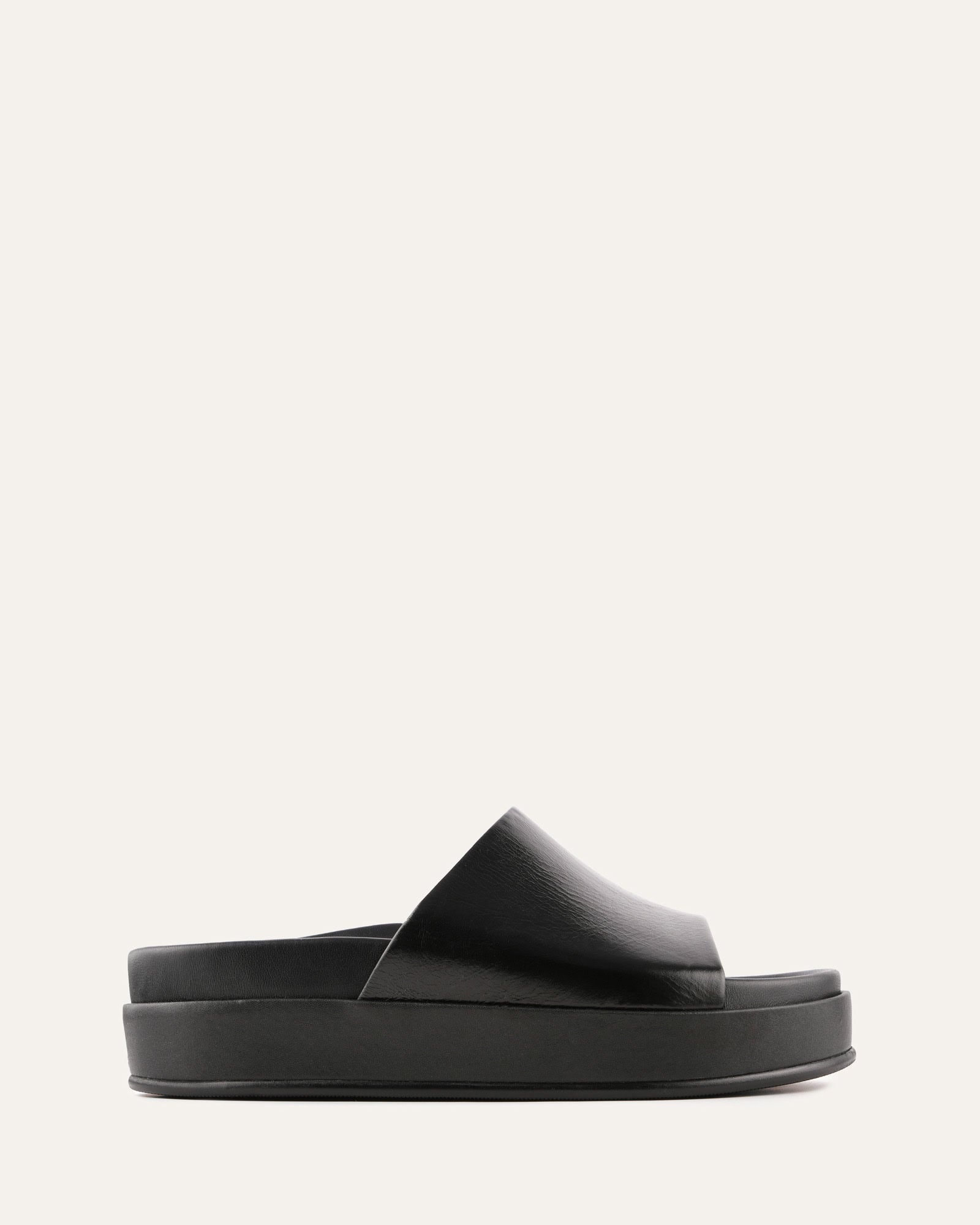 Black sandal on a light gray background