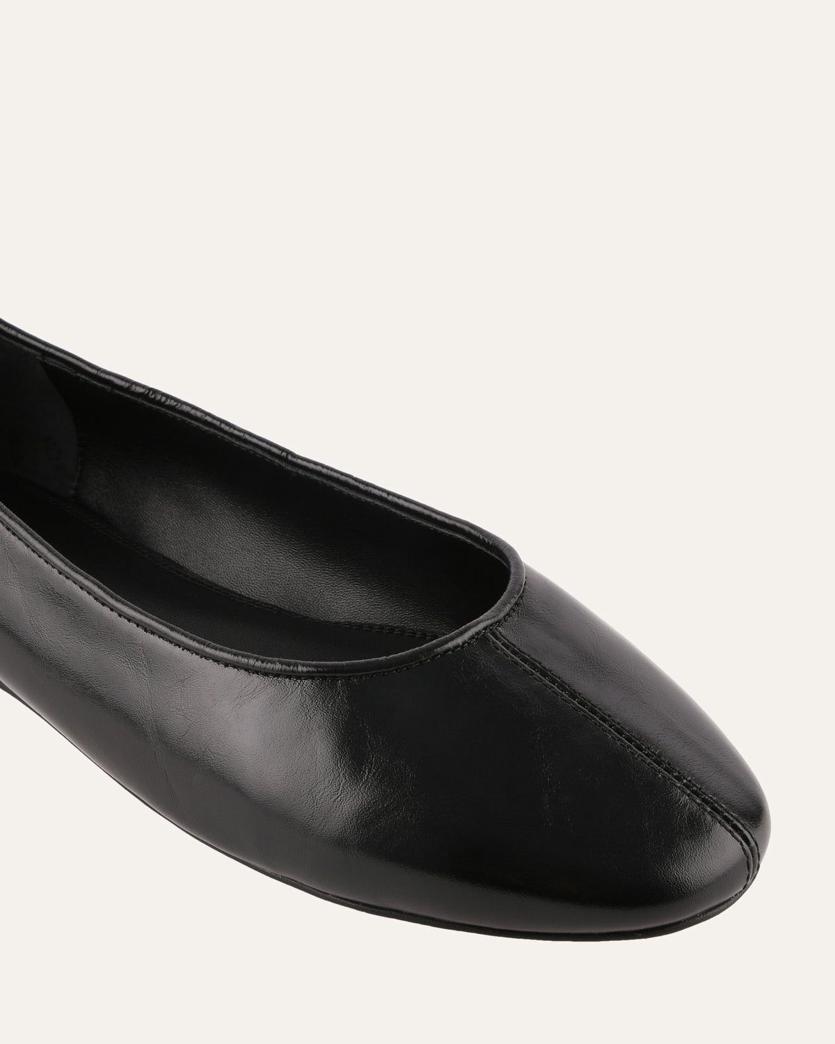 Black flat shoe on a white background