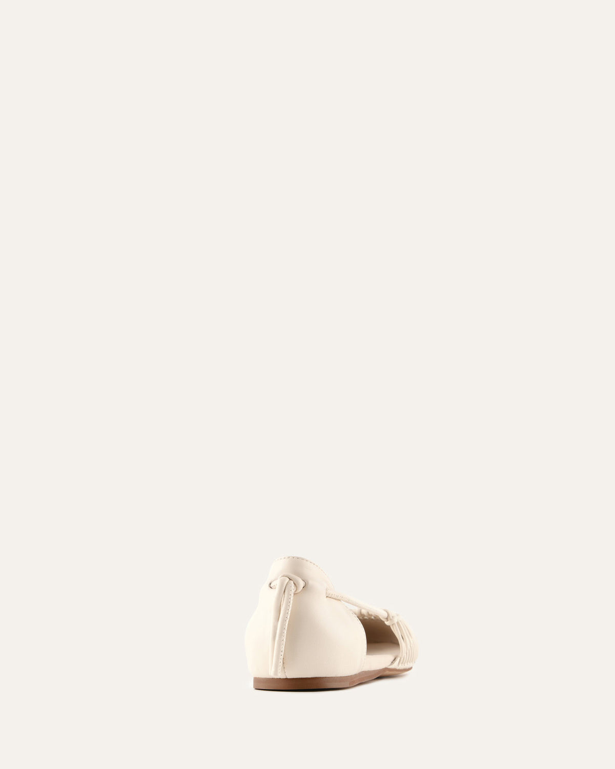 White sandal on a light beige background